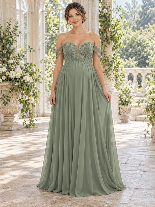 Vestido de dama de honor premamá de encaje y gasa en verde salvia, corte imperio, hombros descubiertos y escote corazón, manga corta y largo hasta el suelo