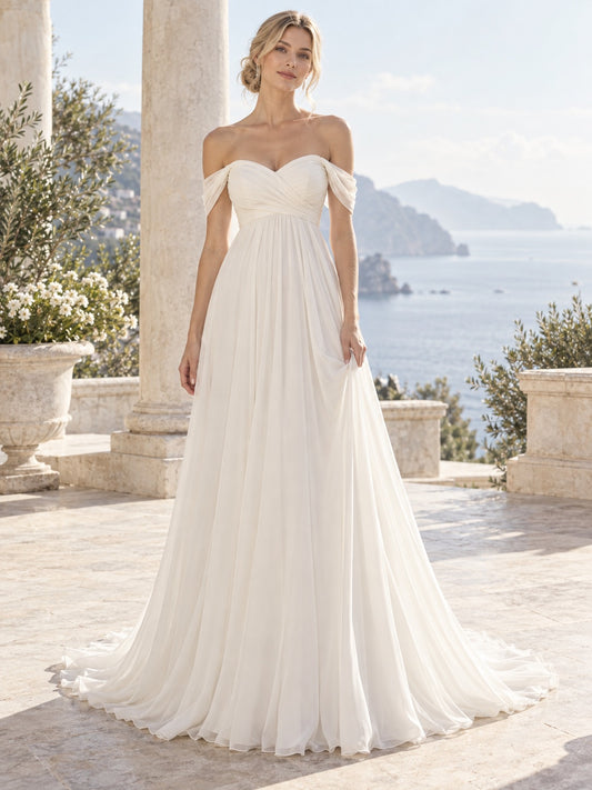 Vestido de novia de gasa en marfil, corte imperio, hombros descubiertos y escote corazón y largo hasta el suelo