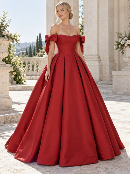 Vestido de satén en rojo, corte princesa, hombros descubiertos y escote corazón, manga corta y largo hasta el suelo