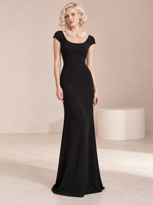 Vestido de novia de crepé en negro, corte recto, escote redondo, manga corta y largo hasta el suelo