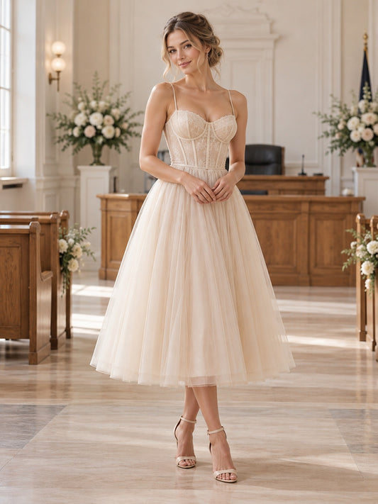 Robe de mariée longueur thé rose poudré coupe église corsage cœur fines bretelles tulle ligne A